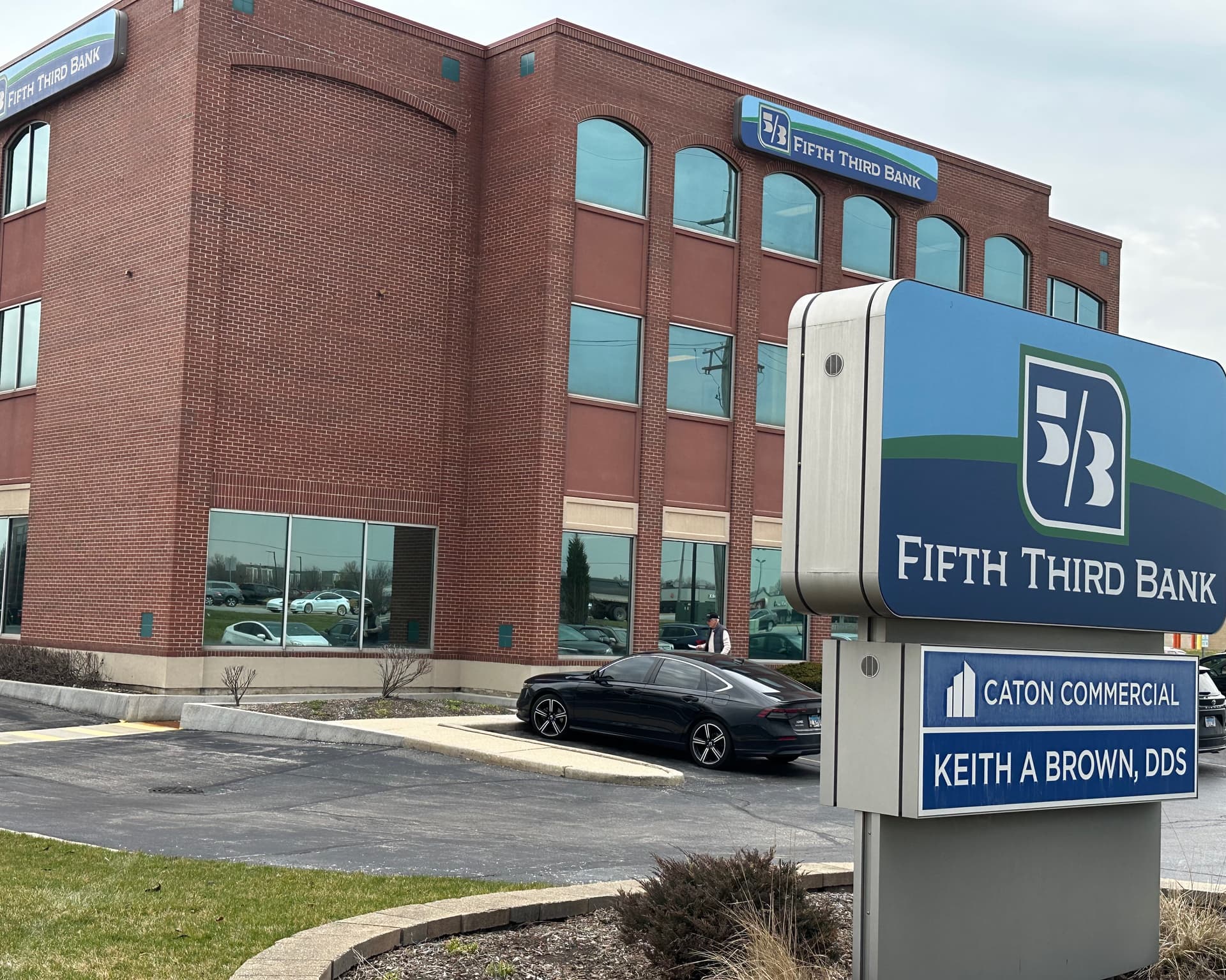 Extended exterior view of the Fifth Third Bank building at 1295 Rickert Drive, Naperville, IL, housing Dr. Brown's dental office.